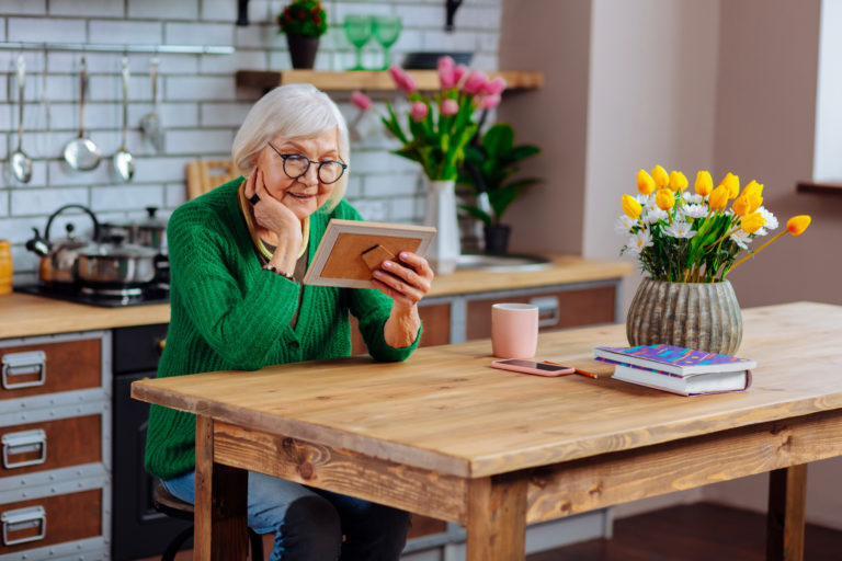 Senior at home using tablet