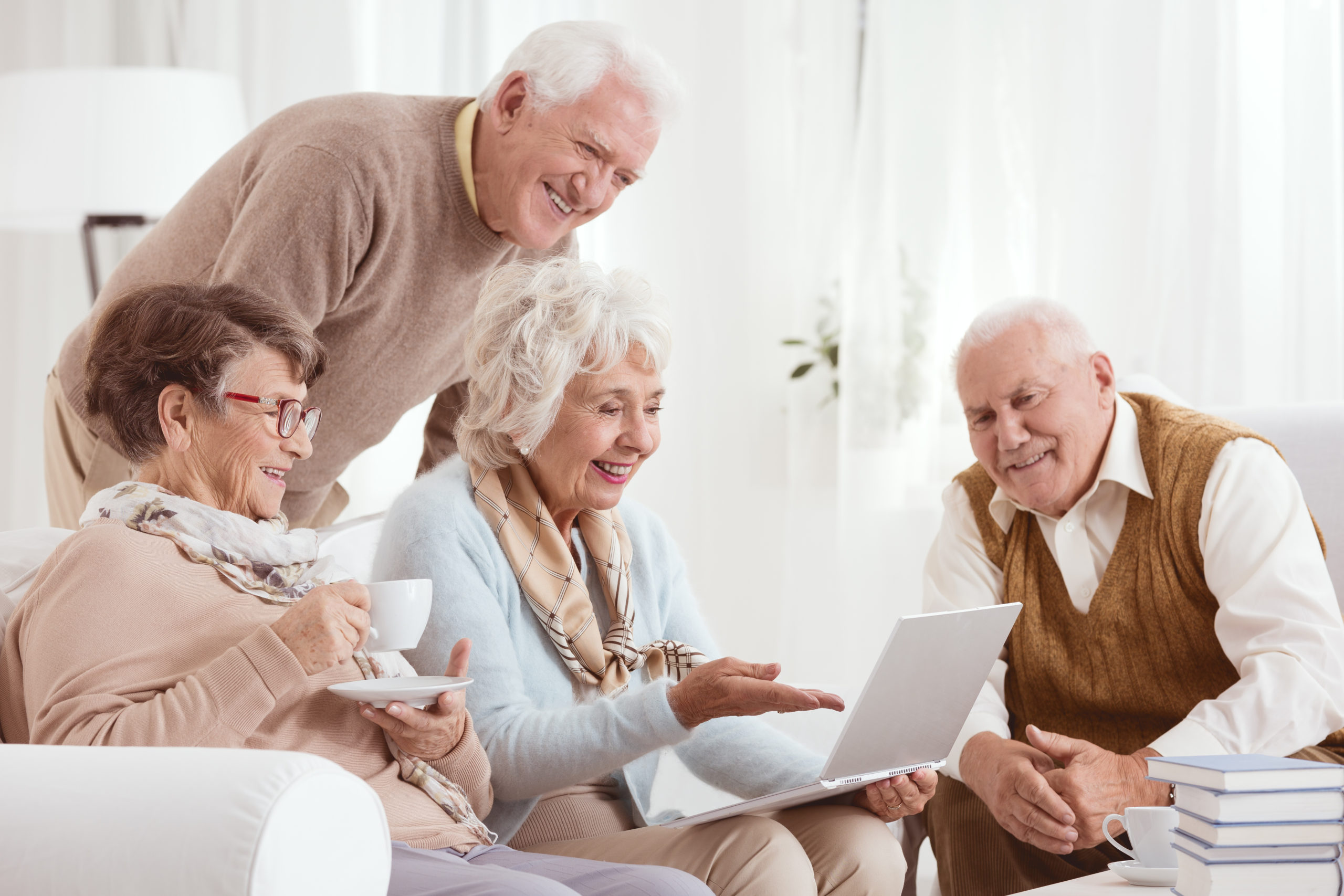 Group of seniors with laptopo